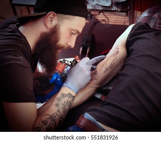 Professional Artist Making Tattoo In Salon, Close Up View