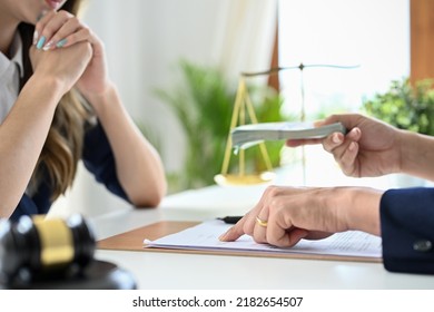 A Professional Asian Female Lawyer Or Business Legal Consultant Having A Secret Meeting With Her Client And Receives A Bribe. Cropped Shot