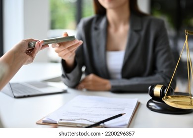 Professional Asian Female Lawyer Or Business Legal Consultant Receiving Money From Her Client After Win A Lawsuit. Cropped And Close-up Hand Image