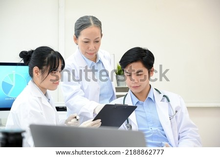 A professional Asian-aged female doctor specialist is giving advice on their new disease case study in the doctor office.