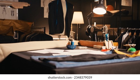 Professional atelier with tailor tools used for custom made tailored items to design fashion collection. Tailor workshop with sewing machines and garment for needlework, small business. - Powered by Shutterstock