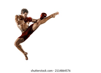 The professional athlete boxer in jump in red gloves isolated on white studio background. Black and white body. Fit muscular caucasian athlete fighting. Sport, competition concept 