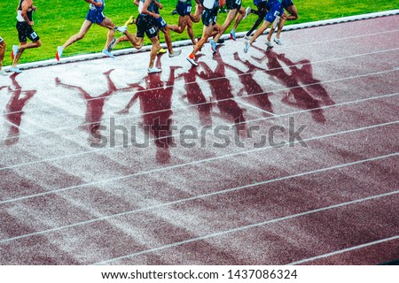 Professional athlete legs during the track and field race. Concept photo for olympic competition in tokyo 2020