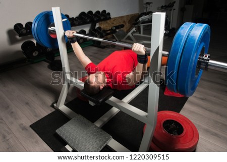 Professional Athlete Is Lying and Is Holding a Very Heavy Barbell