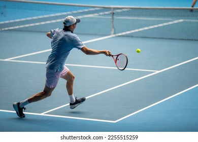 Professional athlete playing tennis on a sports court in europe. - Powered by Shutterstock