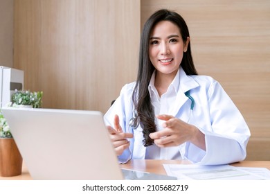 Professional Attractive Asian Female Doctor Diagnosis Talking And Looking To Camera In Video Conference ,Positive Doctor Waving And Having Online Doctor Examine Consultation On Digital Tablet Laptop