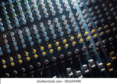 Professional Audio dj mixer console, sound tools and gear, studio equipment picture, selective focus picture of faders and knobs of mixer