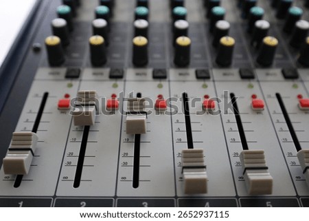 Professional audio mixer control panel used in music recording studios