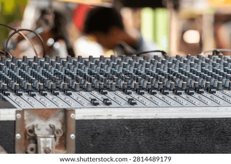 Professional audio mixing console with multiple channel controls for live sound production recording broadcasting and music performance technology