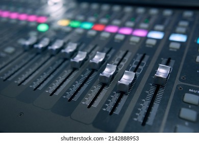 Professional Audio Mixing Console. ​Mixer. Pro Audio Mixing Board Faders And Knobs. Static Shot Of Multi-track Music Recording Equipment Faders And Sliders.       