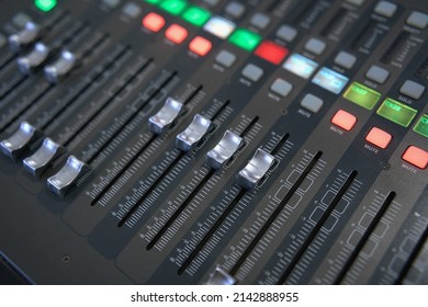 Professional Audio Mixing Console. ​Mixer. Pro Audio Mixing Board Faders And Knobs. Static Shot Of Multi-track Music Recording Equipment Faders And Sliders.       