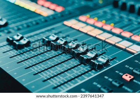 Professional audio studio sound mixer console board panel with recording , faders and adjusting knobs,TV equipment, selective focus