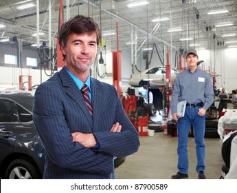 Professional Auto Mechanic  And Manager In Auto Repair Shop. Garage.