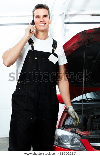 Professional
auto mechanic in auto repair shop.
Garage.