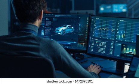 Professional Automotive Graphic Designer Is Working On 3D CAD Software Rendering Electric Concept Car And Calculating Its Efficiency In A High Tech Innovative Laboratory With A Prototype.