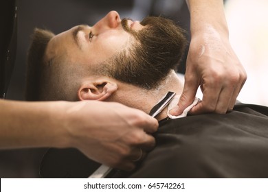 Professional Barber Doing A Haircut