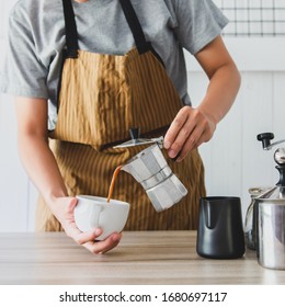 The Professional Of A Barista Poured Milk. Making Hot Coffee With Equipment, Tool Brewing On The Bar At Kitchen Home