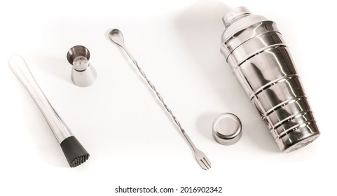 Professional Bartender Kit Set. Cocktail Shaker, Bar Spoon, Jigger And Muddler Isolated On White Background. Cocktail Banner With Copy Space For Text