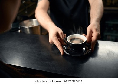 Professional bartender serving the cup of freshly brewed fragrant coffee - Powered by Shutterstock