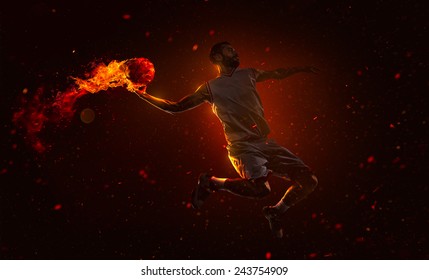 Professional basketball player is shoting the fireball