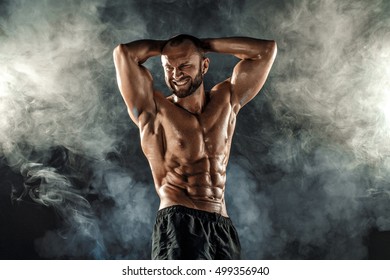 Professional Bodybuilder Posing With Arms On Head