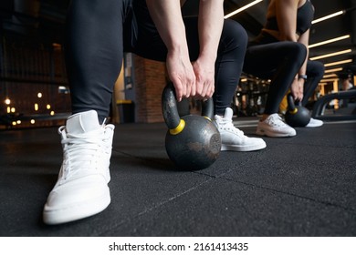 Professional Bodybuilders Doing Weight-lifting Workout At Gym