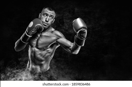 Professional boxer practicing blows in the smoke. Sports betting concept. Mixed media