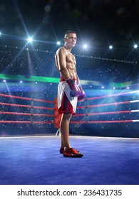 Professional boxer is training on the grand arena in lights