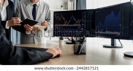 Professional broker present interested stock with growth graph to skilled businesswoman for financial investment. Stock trading. Stock investment. Stock trading market concept. Burgeoning..