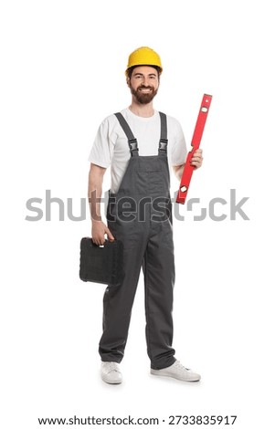 Professional builder with tools on white background