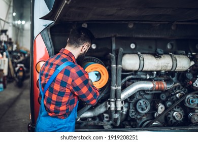 Professional Bus Mechanic Working In Vehicle Repair Service. 