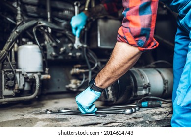 Professional bus mechanic working in vehicle repair service. 