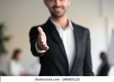 Professional Business Man Hr Consultant Salesman Wear Suit Extending Hand At Camera For Handshake Greeting Offering Cooperation, Welcoming For Collaboration, Introduction Concept, Close Up View