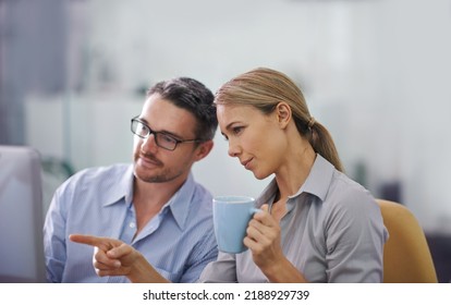 Professional business people working together on a computer, doing quality assurance and looking at information. A corporate man and woman thinking of ideas and analyzing investment statistics - Shutterstock ID 2188929739