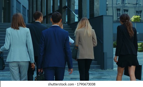 Professional Business Team Of Ambitious Young Office Workers Going To Work Entering Modern Corporate Building. Business People. Teambuilding. Collaboration.