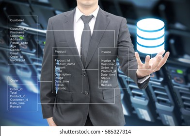 Professional businessman hold Database table with server storage and network in datacenter background