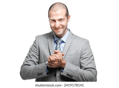 Professional businessman in a suit smiles warmly with his hands clasped