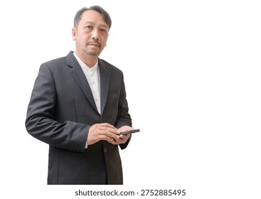 A professional businessman using a smartphone while standing against a clean light background with copy space. The image represents modern business communication, mobile technology, digital connectivity, and professional work in the digital era.