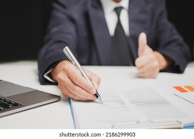 Professional Businessman Wear Suit Hand Holding Pen Writing And Sign Paperwork Or Document Finance At Office, Man Manager Person Handwriting Paper On Clipboard Signature Agreement Approval Business