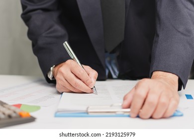 Professional Businessman Wear Suit Hand Holding Pen Writing And Sign Paperwork Or Document Finance At Office, Man Manager Person Handwriting Paper On Clipboard Signature Agreement Approval Business