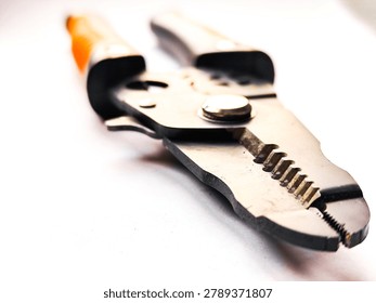 Professional cable stripper and wire cutting tool isolated on white background.