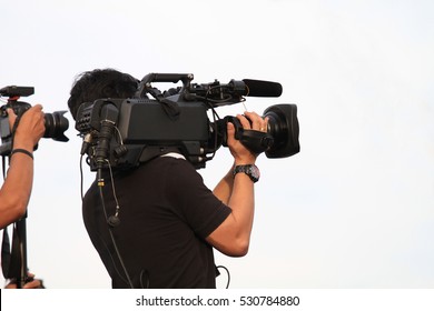 professional cameraman - covering on event with a video - with white background