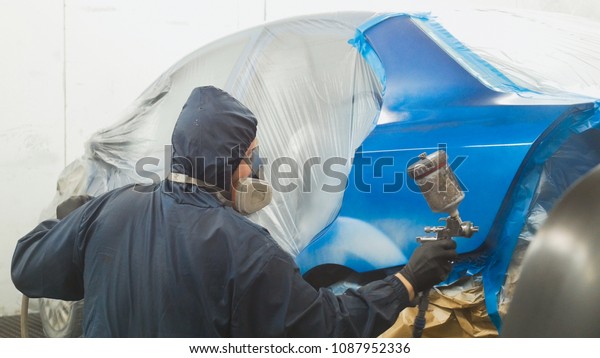 Professional car painter
in vehicle
workshop