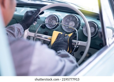 Professional Car Service Male Worker, With Orbital Polisher, Polishing Green Classic Vintage Car In Auto Repair Polishing Shop