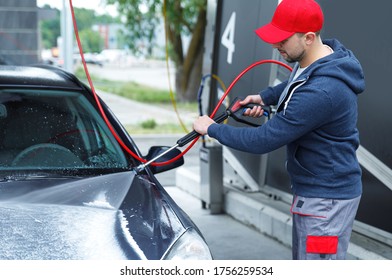 Professional Car Wash Worker Is Washing Client's Car