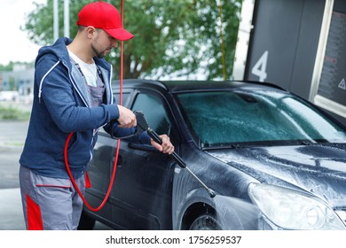 Professional Car Wash Worker Is Washing Client's Car