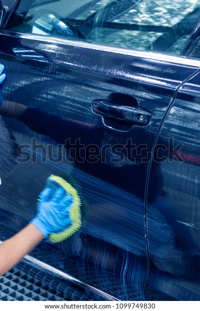 \
Professional car\
wash, workers are cleaning\
cars