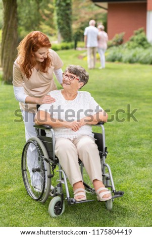 Similar – Senior woman in a wheelchair with her daughter