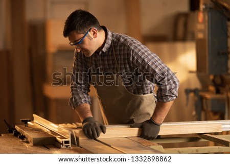 professional carpenter at work in his workshop