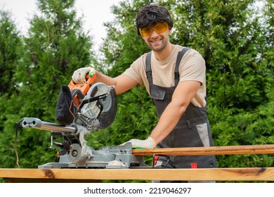 Professional carpenter works with a circular saw in the backyard. - Powered by Shutterstock